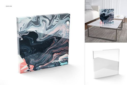 Mockup of a plexiglass tile displaying a bold marbled design, placed on a modern coffee table in a living room.