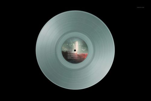 Top view of a translucent vinyl record mockup with a visible central label, set against a solid black backdrop.