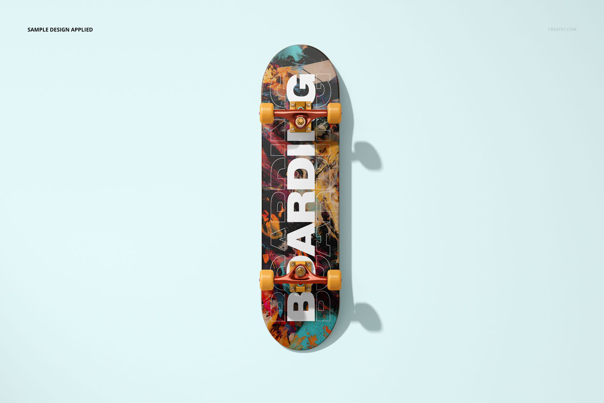 Skateboard deck mockup with colorful abstract design, yellow wheels, and top view on a light background.
