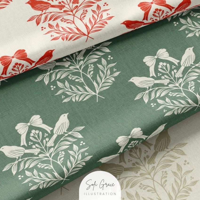 Cotton fabric mockup showing three folded pieces with botanical and bird patterns in red, green, and beige tones.