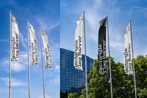 PSD mockup of rectangular flag banners in different colors, shown on flagpoles in front of a modern building and green trees.