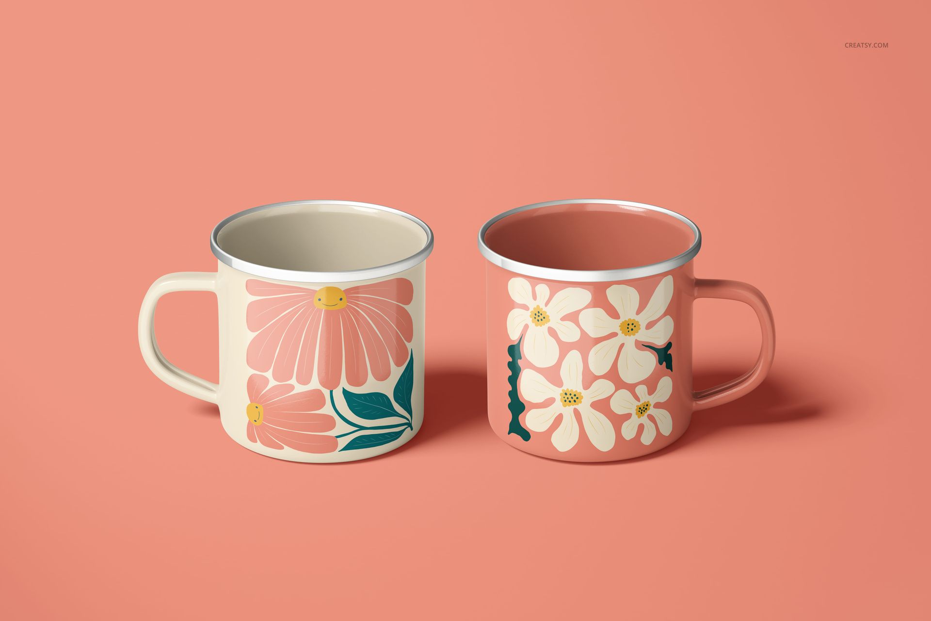PSD mockup of enamel mugs with floral prints, placed against a solid peach background with soft lighting.