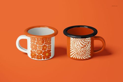 Front view of two 100ml enamel mugs with orange floral and swirl patterns on an orange background.