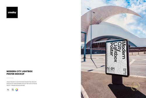 Outdoor city lightbox poster mockup displayed on a sidewalk with modern architecture and blue sky in the background.