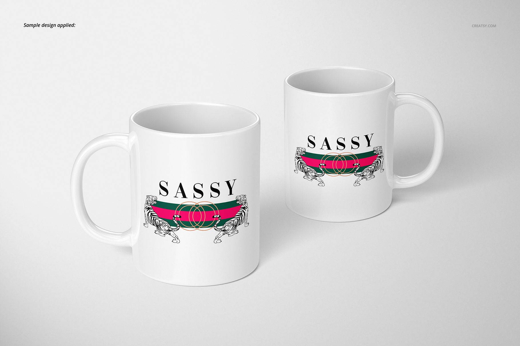 Two white 11oz mugs with a bold 'SASSY' text and graphic design, displayed on a light background, front and angled view.