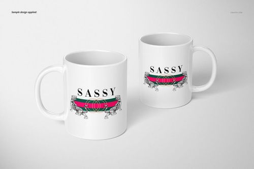 Two white 11oz mugs with a bold 'SASSY' text and graphic design, displayed on a light background, front and angled view.