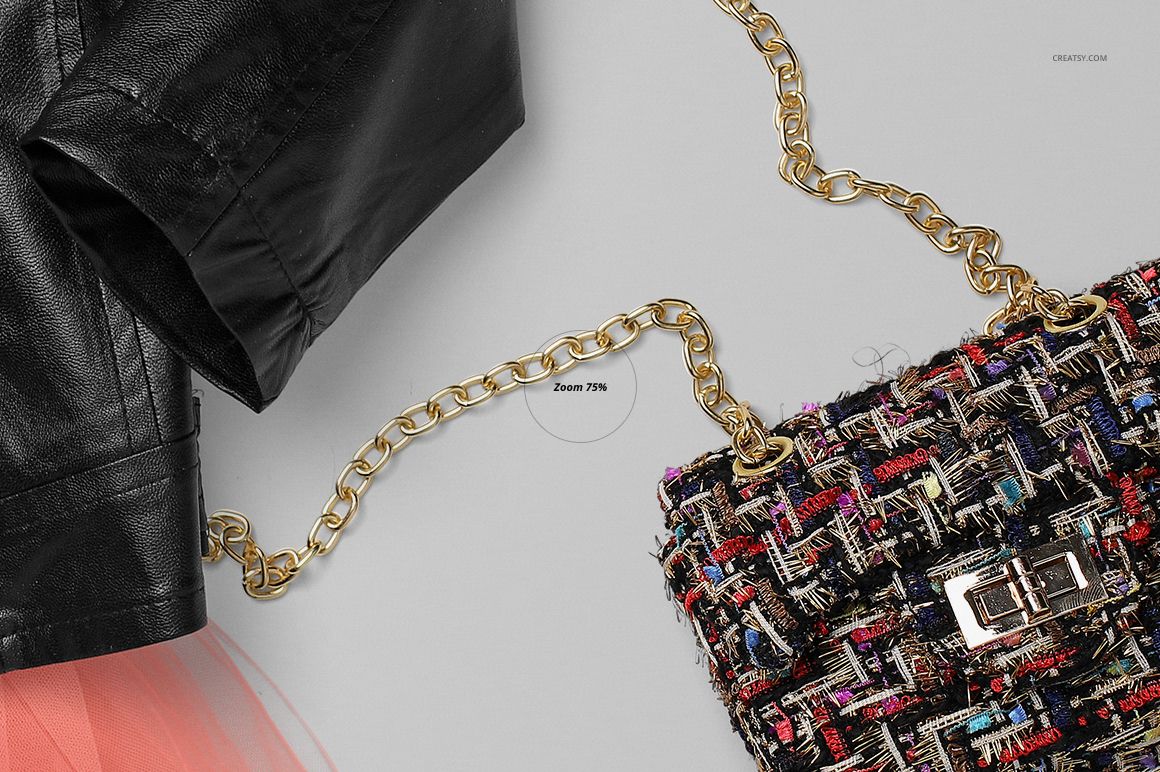 Flat lay of a girls chic set mockup featuring a black faux leather jacket, pink tulle skirt, and a textured handbag with a gold chain.