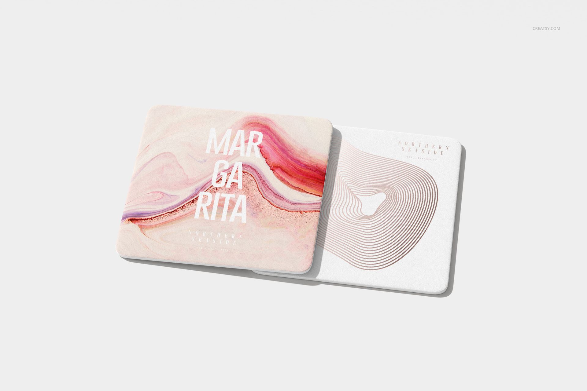 Square coasters mockup with one coaster showing a swirling pink and cream pattern and another with minimalist beige lines.