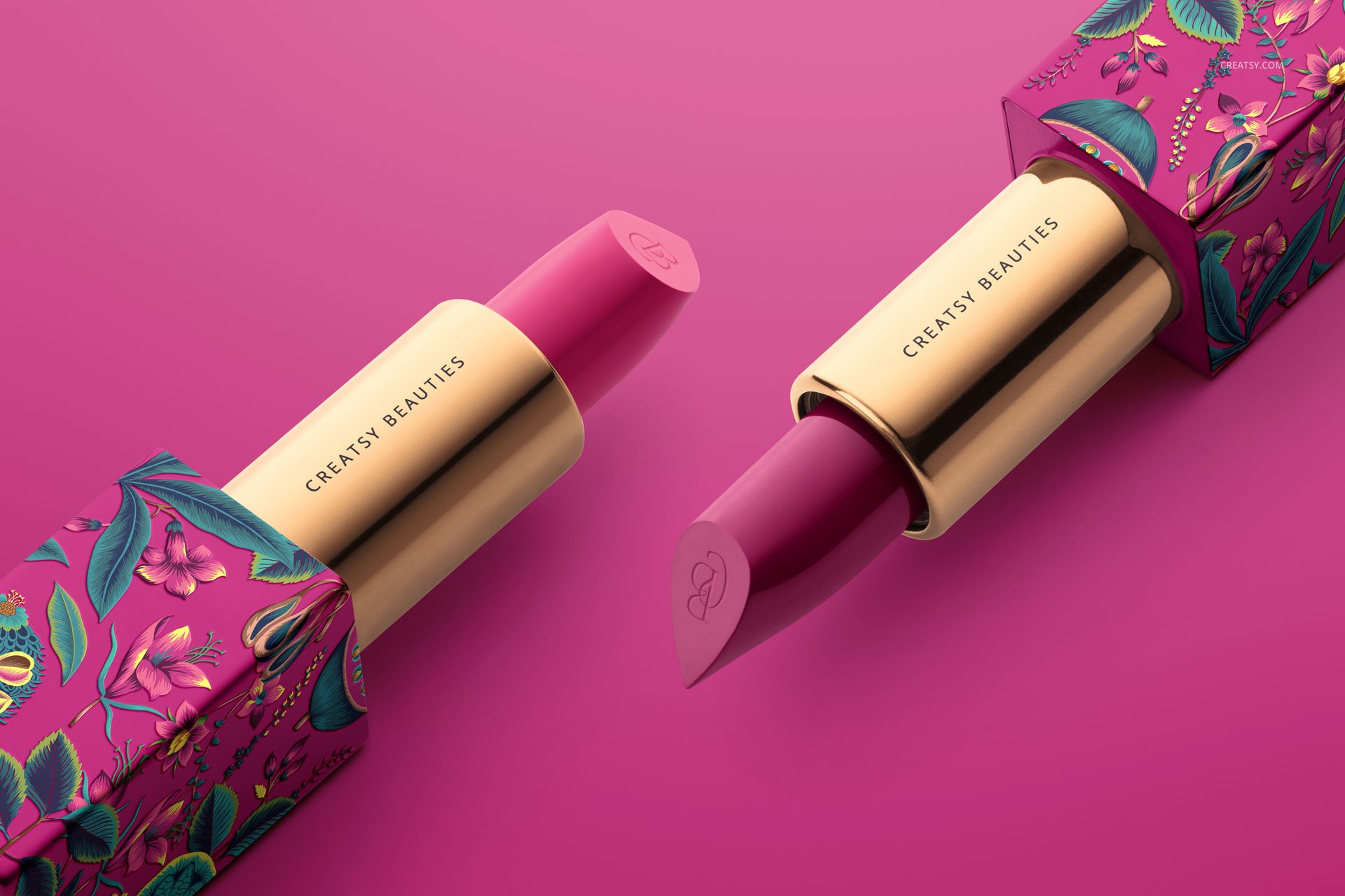 Classic lipstick mockup featuring gold tubes and vibrant floral boxes, shown from a close-up perspective on pink surface.