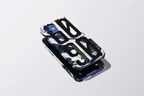 Glossy snap case for iPhone 12 with abstract black and white graphic design, shown in a PSD mockup on a light surface.