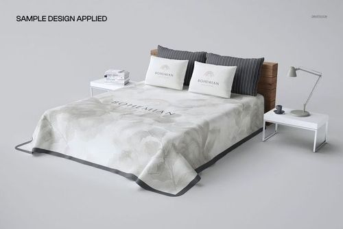 Perspective view of a plain bed coverlet mockup with subtle floral patterns, placed on a modern bed with two pillows and a wooden headboard.