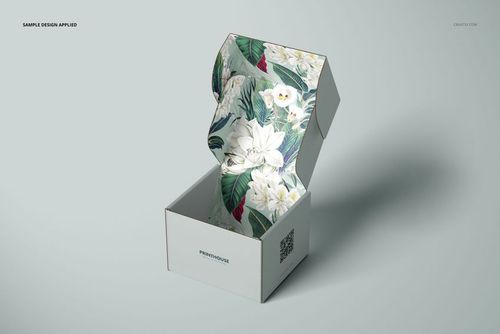 Front view of an open mailer box mockup with a floral pattern on the inside, displayed on a light gray surface.