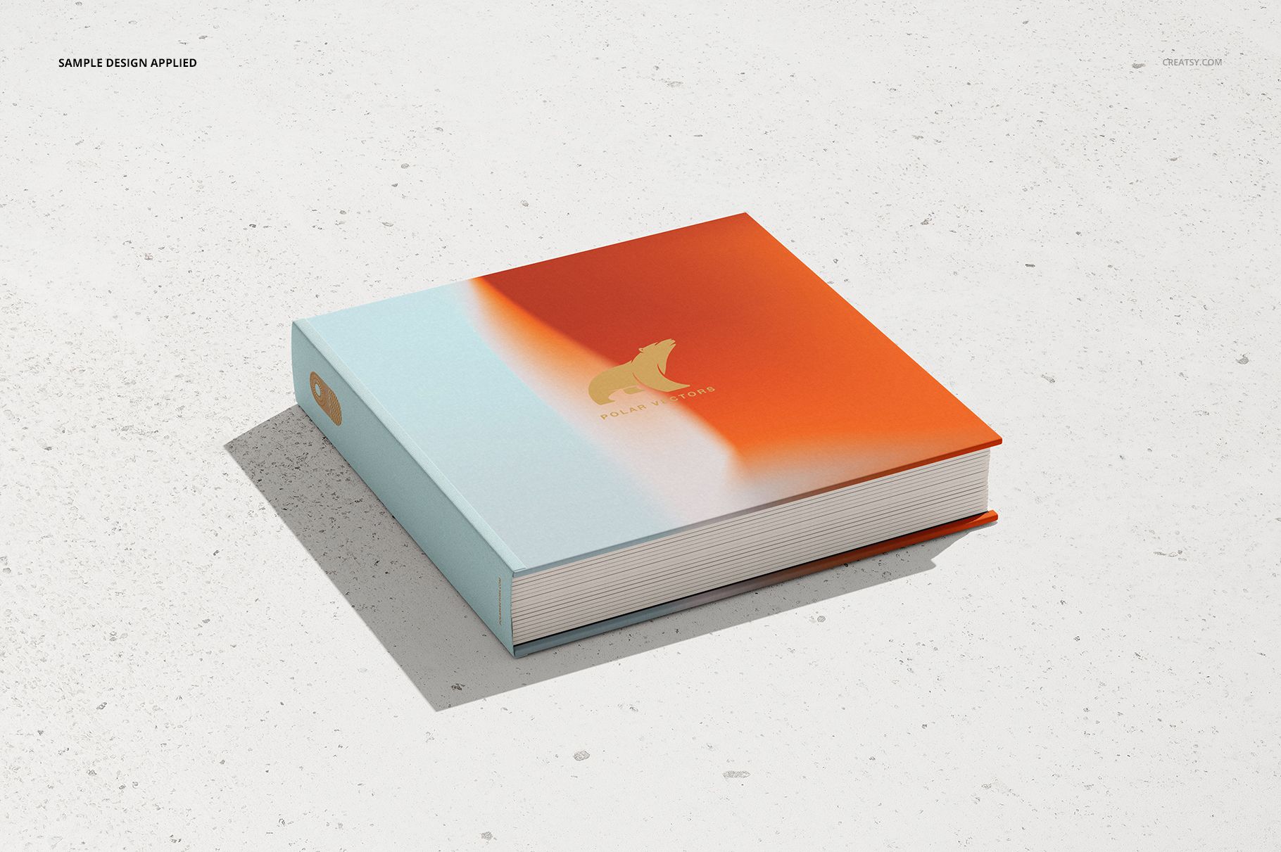 Hardcover artbook mockup with a gradient orange and light blue cover, shown in a front angled view on a white surface.