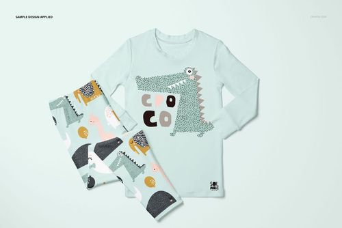 Kids long sleeve pajama set mockup featuring a light blue top with crocodile print and patterned pants, front view.