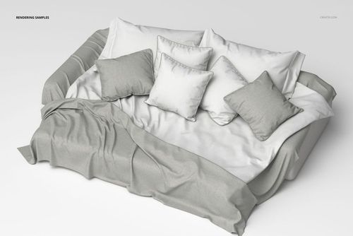 Front view of a luxury bedding set with soft gray and white pillows and a matching blanket on a bed in a minimal scene.