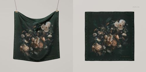 Silk scarf with dark green background and floral pattern, shown hanging and laid flat in a fashion accessory mockup.
