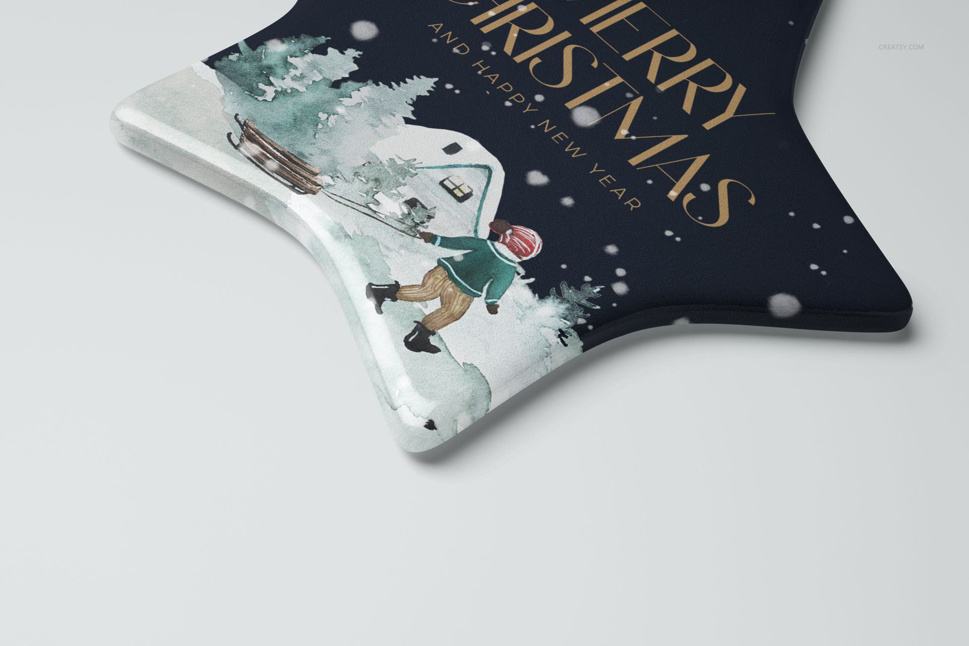 Star-shaped ceramic Christmas ornament mockup featuring a festive winter scene and gold lettering, close-up view.