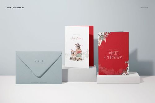 Three 5x7 greeting cards mockup displayed on white platforms, featuring two upright cards and one envelope in soft blue.