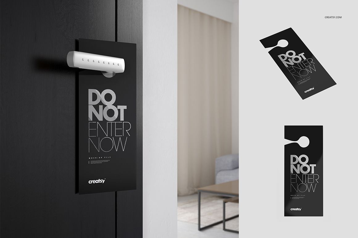PSD mockup of a black door hanger with large white lettering, displayed on a sleek door handle and isolated background.