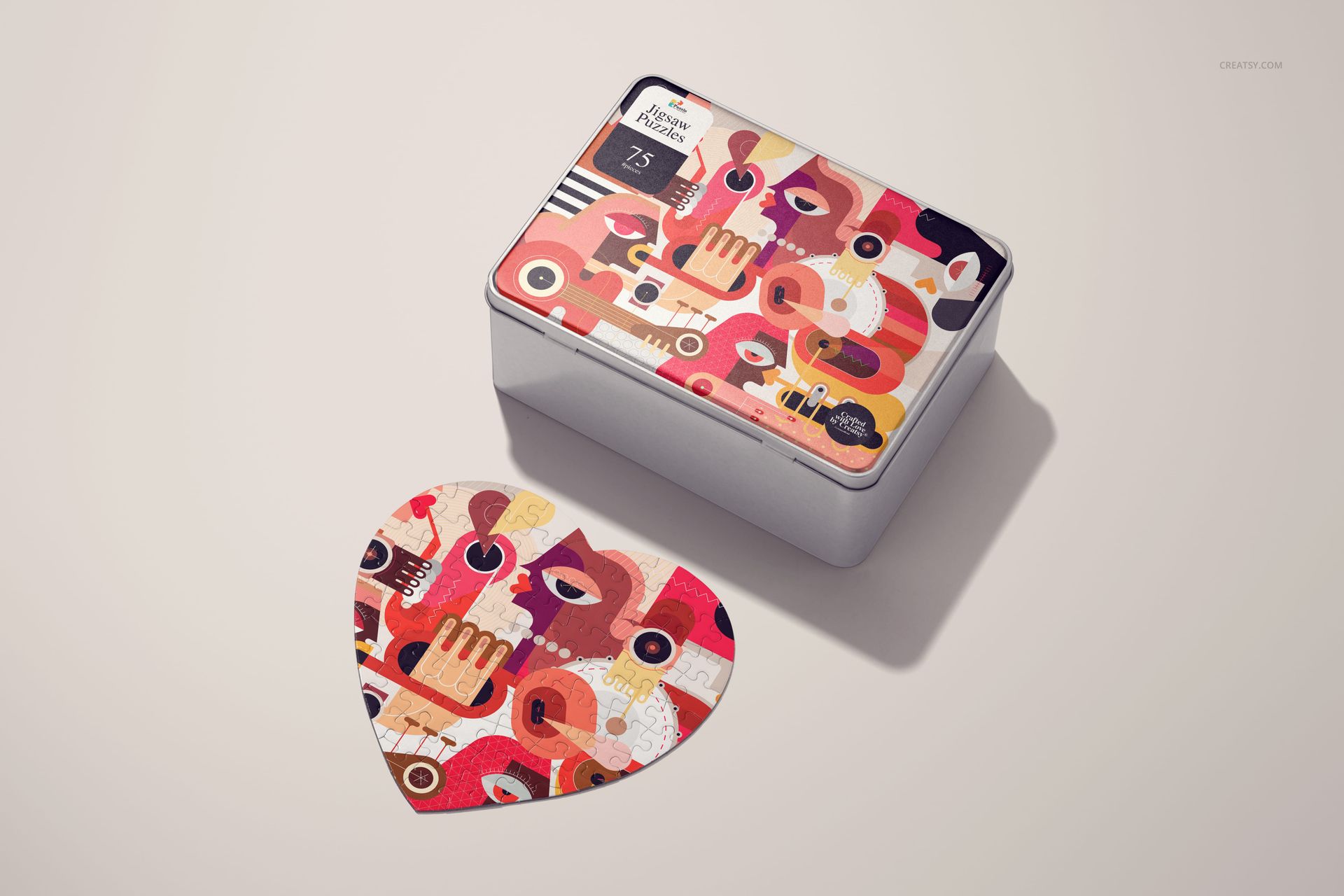 Heart jigsaw puzzle mockup featuring vibrant abstract artwork beside a metal storage box with similar pattern and colors.