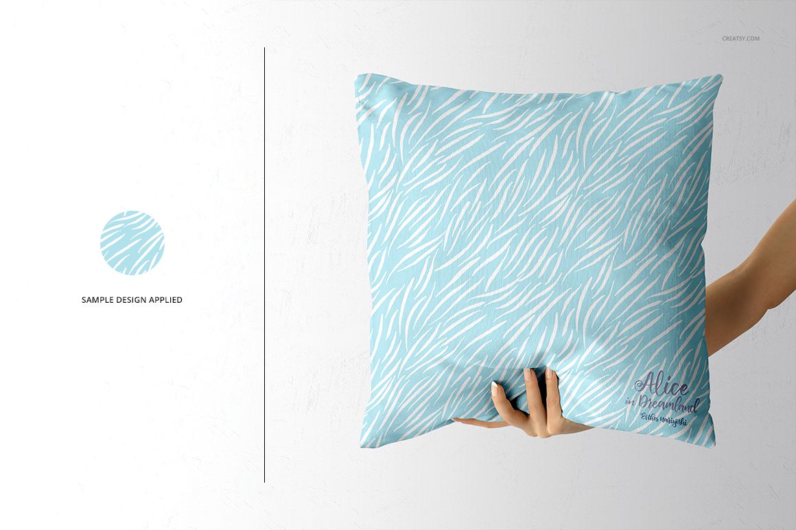 PSD mockup of a decorative throw pillow with a blue and white pattern, displayed against a white textured background.