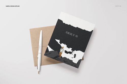 Front view of an A2 card mockup featuring a minimal illustration, accompanied by a brown envelope and a white pen.