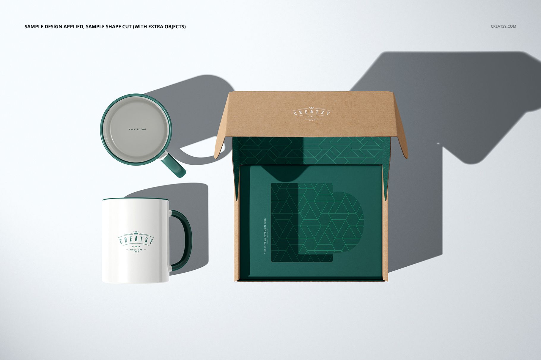 PSD mockup featuring a brown cardboard box with green geometric insert and two ceramic mugs, viewed from above.