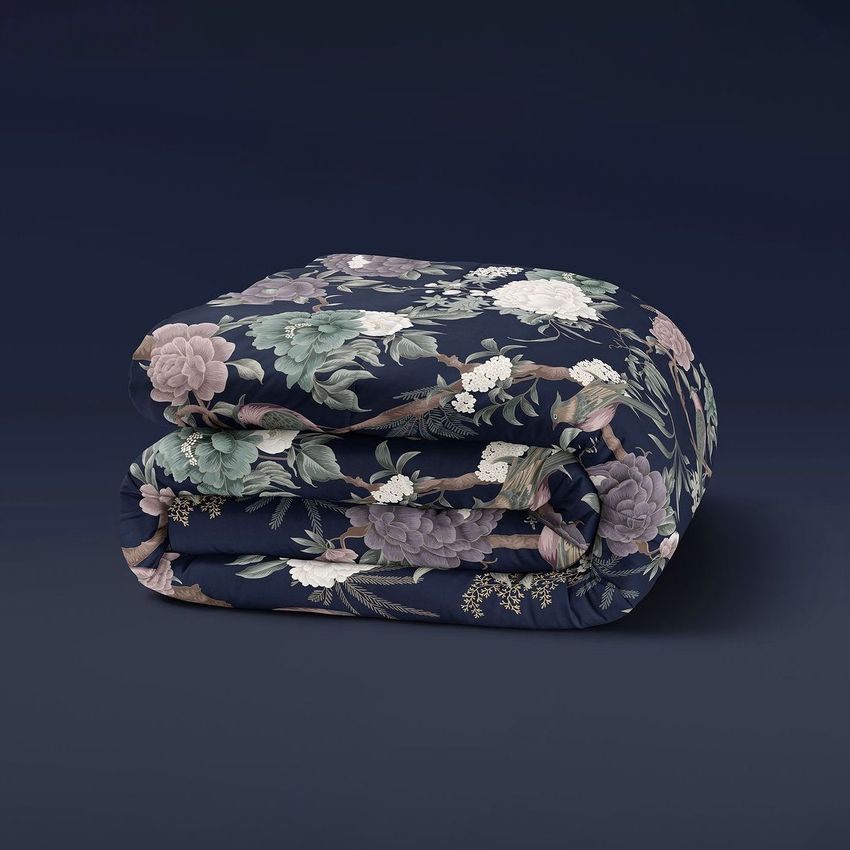 Microfiber comforter mockup featuring a folded blanket with a dark background and a floral pattern in muted tones.