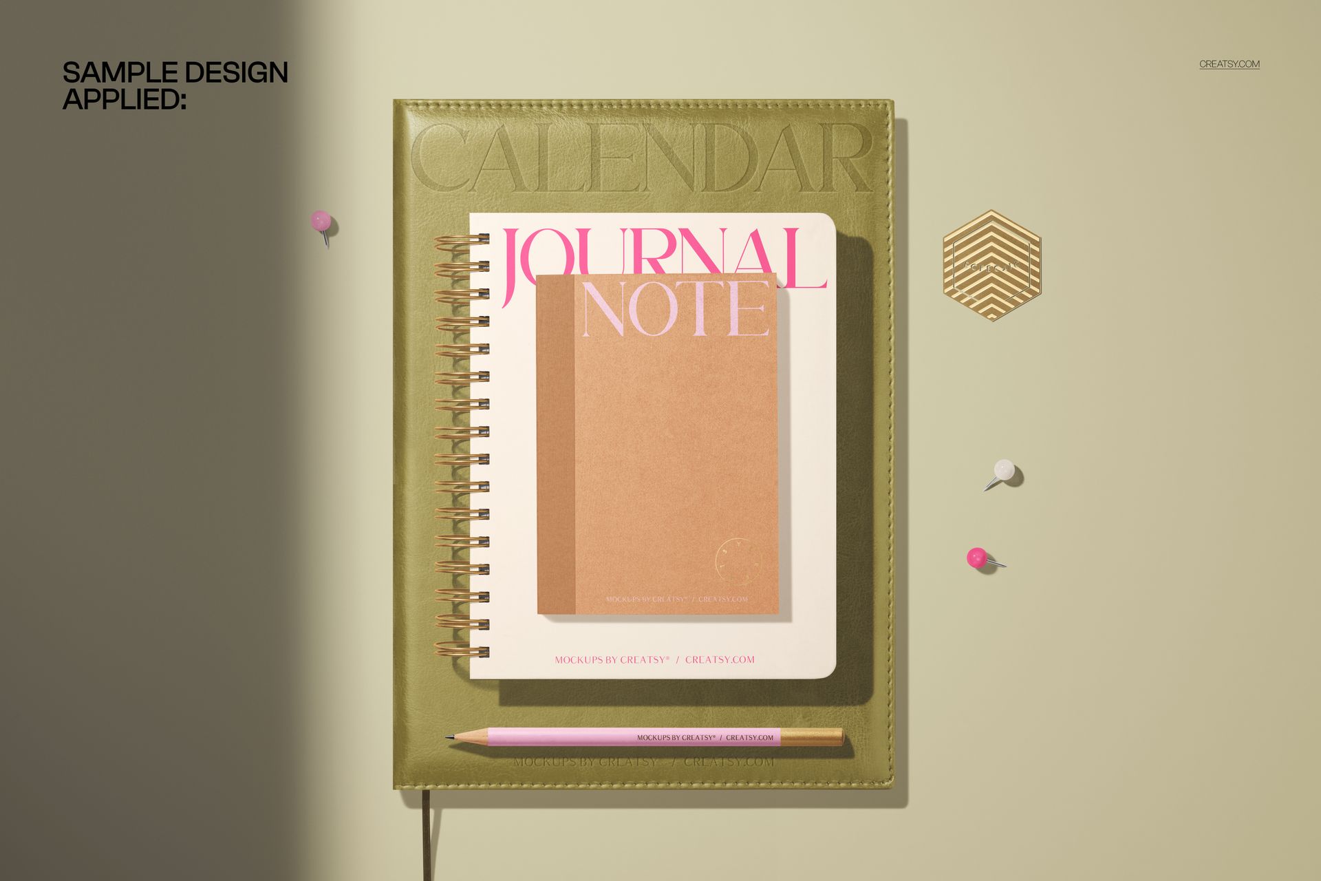 Top view of a leather spiral planner and small notebook mockup with a pencil, push pins, and soft shadows.