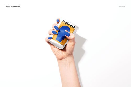 PSD mockup of a paper cup featuring bold blue and yellow artwork, gripped by a female hand with painted nails.