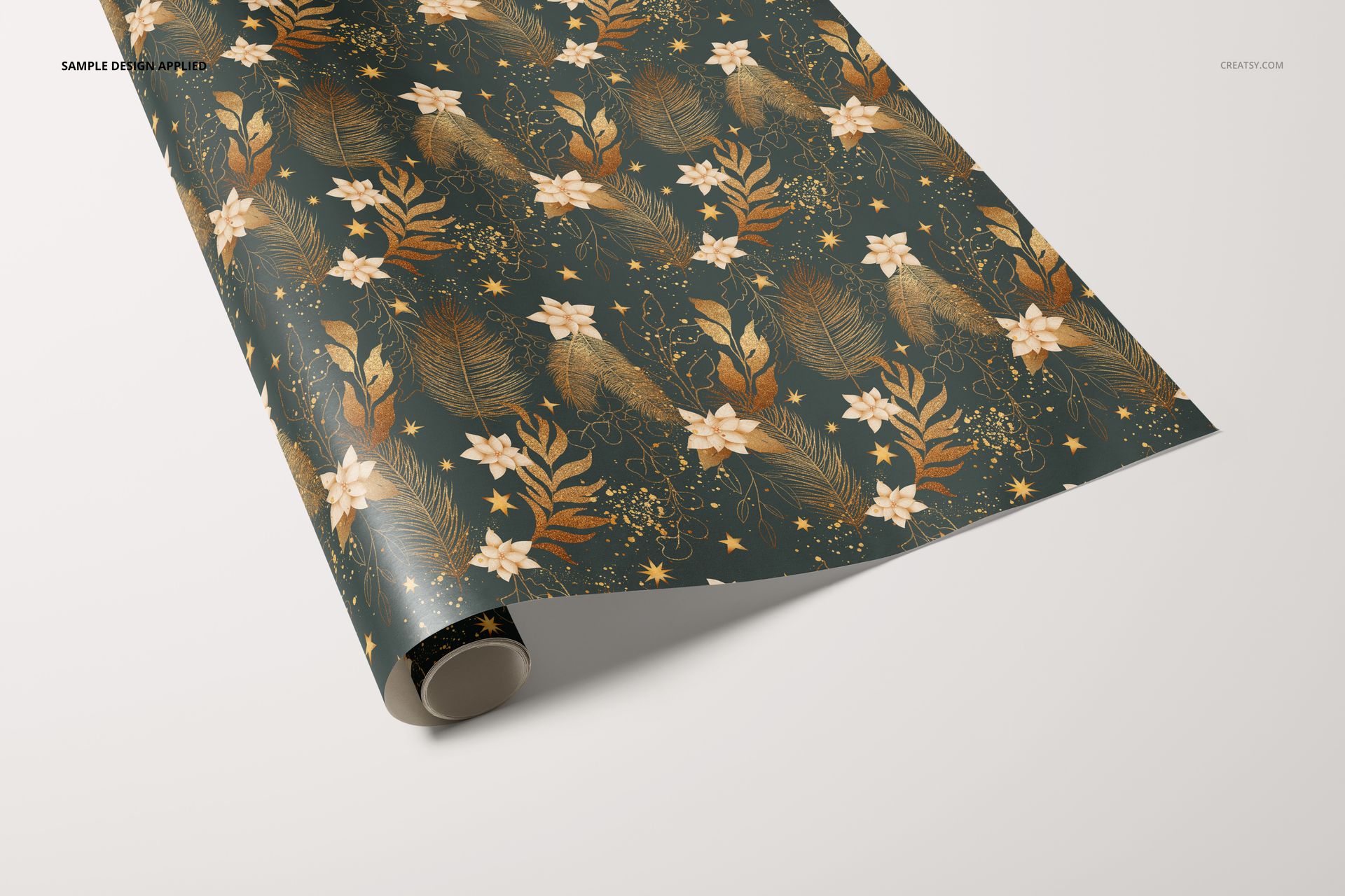 Gift wrapping paper mockup featuring a dark green background with gold leaves, birds, and floral motifs, displayed partly unrolled.