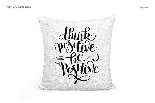 Square reversible sequin pillow mockup featuring white sequins and bold black script lettering on the front.