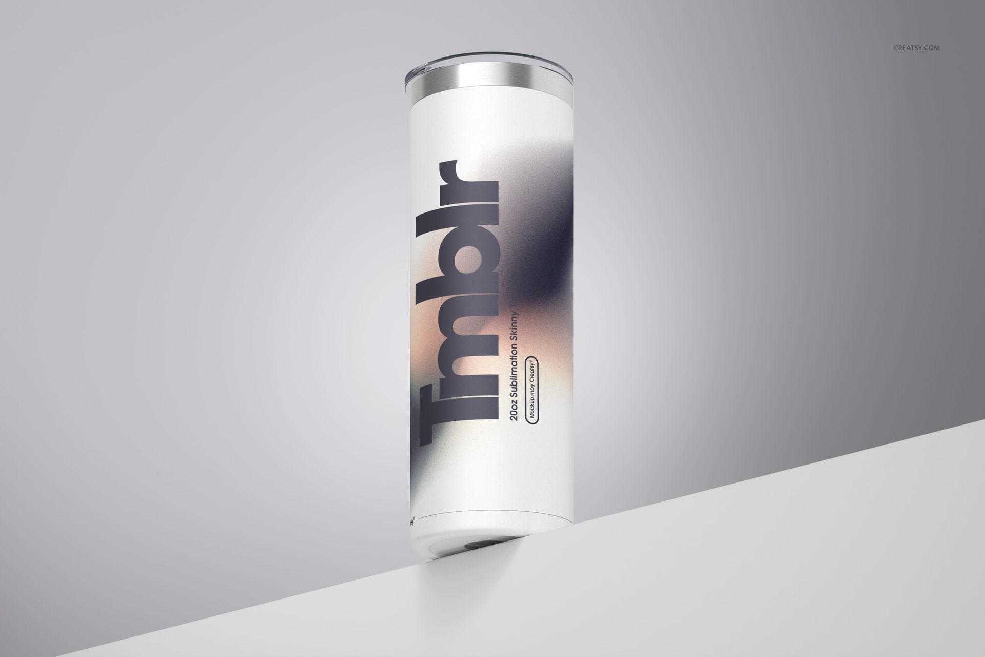 Front view of a powder coated skinny tumbler with a stainless steel lid, displayed on a white angled surface.