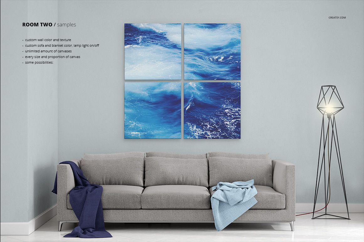 PSD mockup showing a contemporary room with a sofa, floor lamp, and four blue ocean-themed canvas prints on a pale wall.