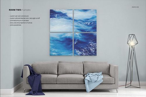 PSD mockup showing a contemporary room with a sofa, floor lamp, and four blue ocean-themed canvas prints on a pale wall.