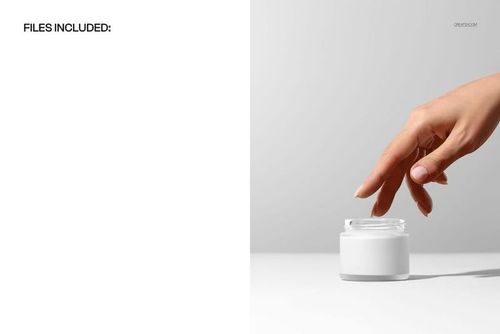PSD mockup showing a transparent glass cosmetic jar with a white lid and a hand touching the jar, minimal setting.