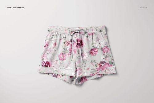 Short silk pajama mockup featuring floral print in shades of pink and purple, displayed from a top-down perspective.