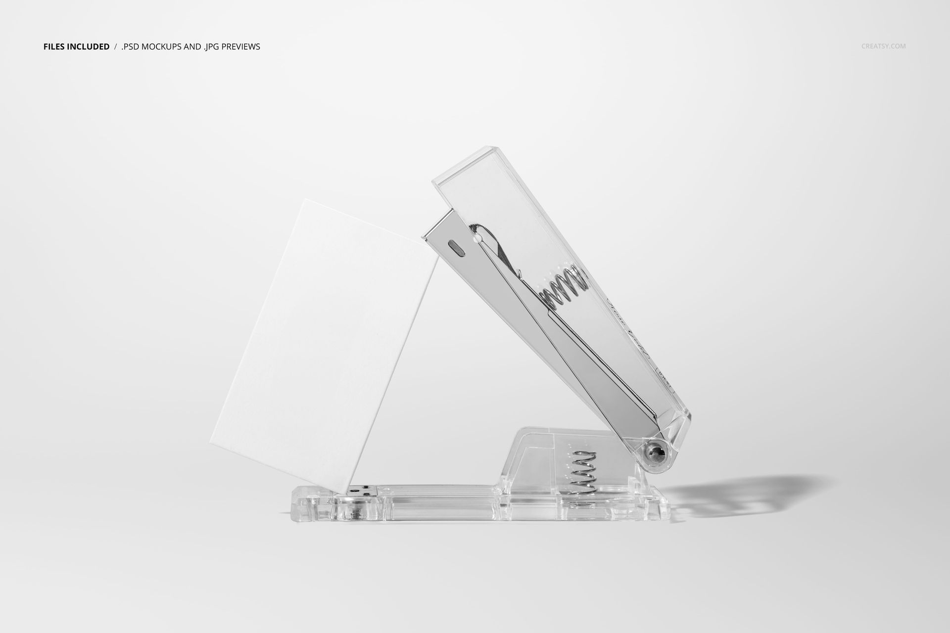 Transparent stapler holding a blank business card, displayed on a white background in a side view mockup scene.