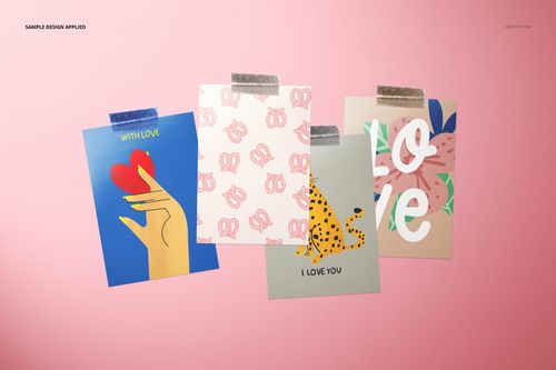 PSD mockup featuring four valentines cards, each with unique patterns and colors, taped on a pink background.