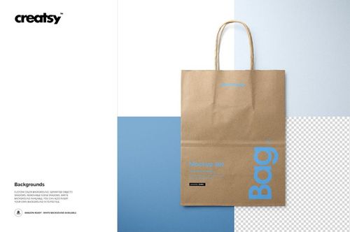 Natural kraft shopping bag mockup displayed upright with twisted paper handles against a split blue and white backdrop.
