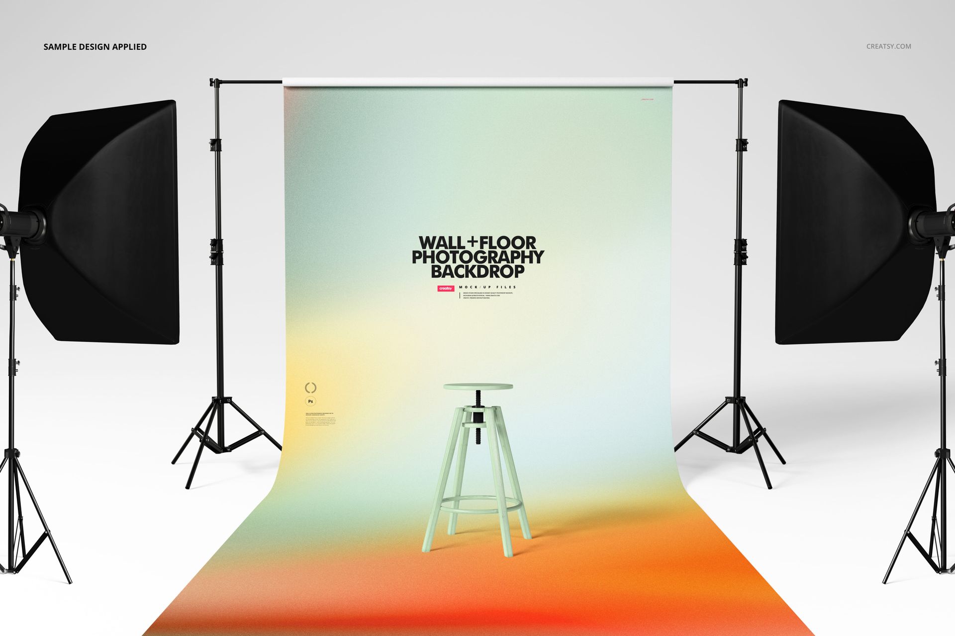 Roll-up photography backdrop mockup with gradient colors, stool in center, and two studio lights on each side, front view.