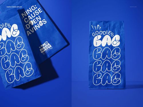 PSD mockup of blue paper fast food bags with playful white typography, arranged on a monochromatic blue surface.