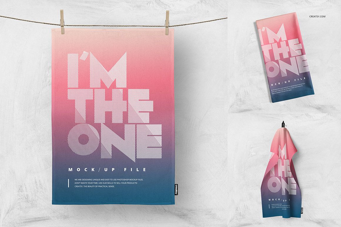 Kitchen towels in a PSD mockup set, featuring pink and blue gradient colors and bold geometric text, shown hanging and folded.