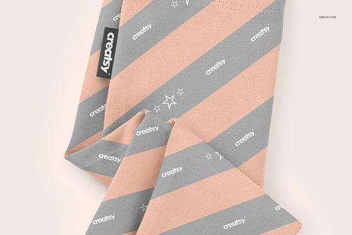 Baby leggings mockup featuring diagonal peach and gray stripes with small star accents, shown in a close-up top view.