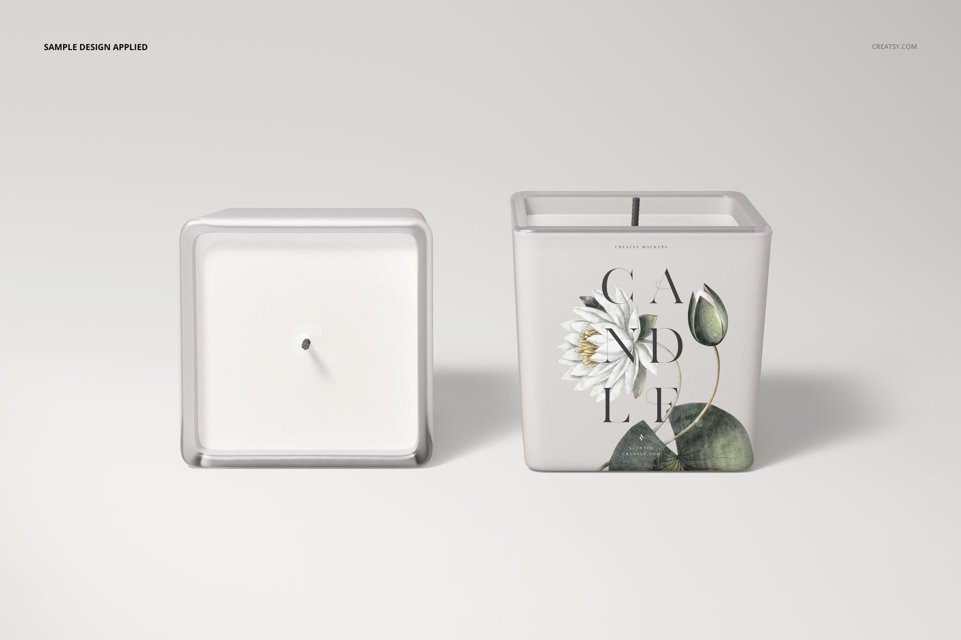 Square candle mockup featuring two candles, one with a floral label design and one showing the top view of white wax.