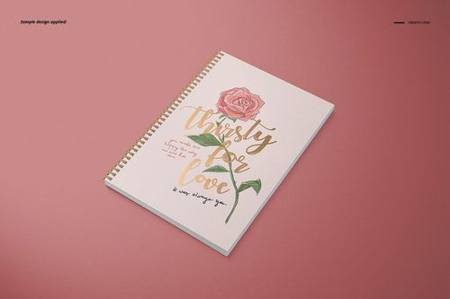 Spiral-bound A4 notebook mockup with square holes and illustrated rose cover, displayed on a solid pink background.