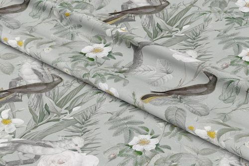 Close-up of polyester curtain fabric mockup displaying a detailed design with birds, foliage, and blooming white flowers.
