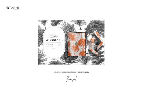 Fabric layers mockup featuring folded textiles with orange and black woodland patterns, viewed from above.