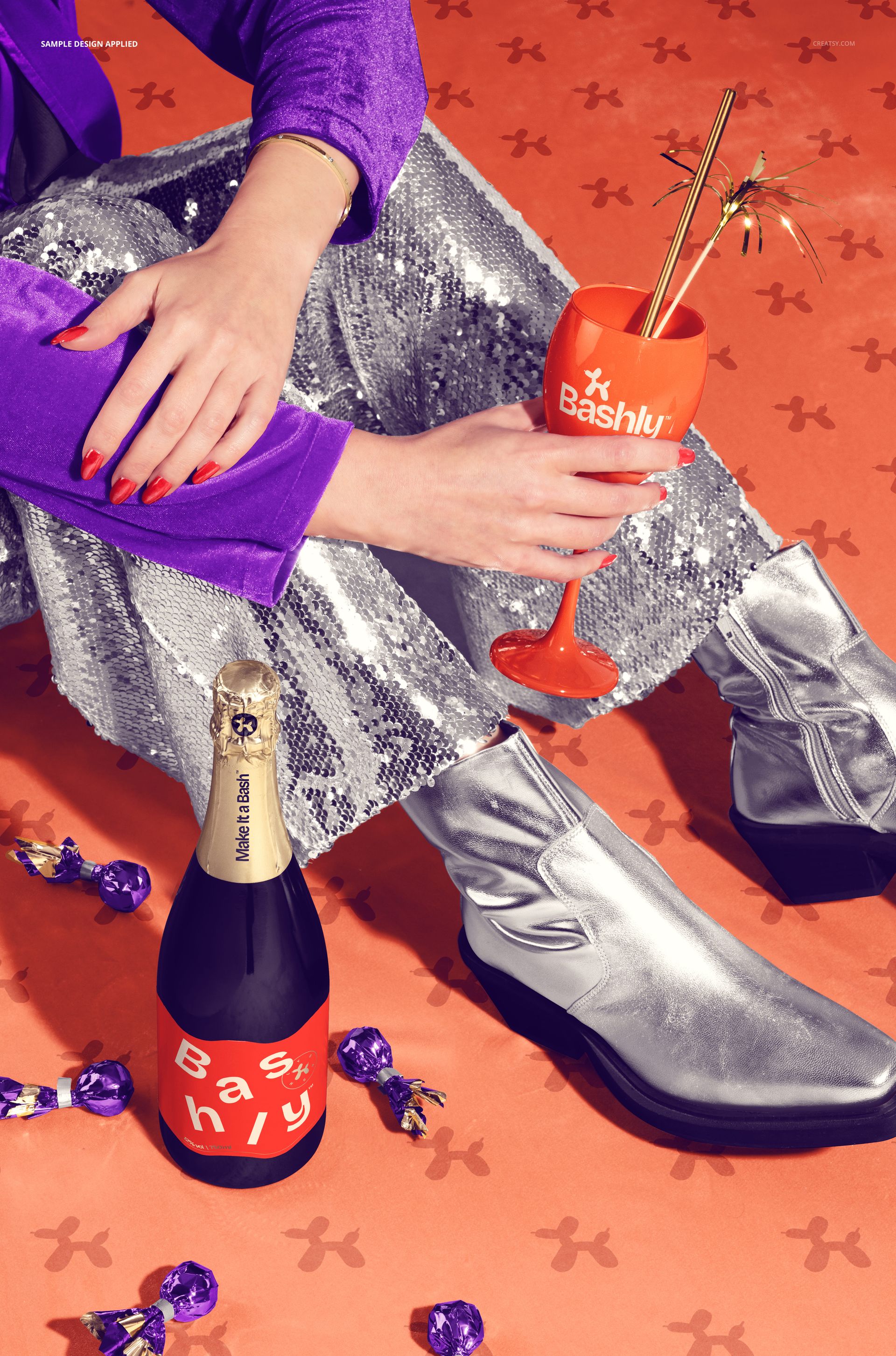 Front view of a New Year scene with a velvet carpet, silver boots, sequin pants, and champagne mockup bottle and glass.