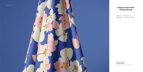 Cotton fabric mockup displaying a vibrant floral design, shown hanging with soft folds and a blue background.
